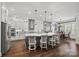 Stunning kitchen with an island, stainless steel appliances, and modern lighting at 7150 Irongate Dr, Indian Land, SC 29707