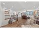 Upstairs living room featuring hardwood floors, comfortable seating, and natural light from the windows at 7150 Irongate Dr, Indian Land, SC 29707