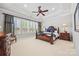 Spacious main bedroom featuring tray ceilings, lots of natural light, and beautiful furniture at 7150 Irongate Dr, Indian Land, SC 29707