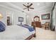 Bright main bedroom featuring tray ceilings, hardwood furniture, and lots of natural light at 7150 Irongate Dr, Indian Land, SC 29707