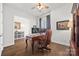 Sophisticated home office with hardwood floors, an elegant desk, and comfortable leather chair at 7150 Irongate Dr, Indian Land, SC 29707