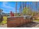 Stylish outdoor kitchen with stainless steel grill and ample cabinet space, ideal for backyard barbecues at 7150 Irongate Dr, Indian Land, SC 29707