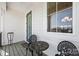 Cozy front porch with seating area offers a relaxing outdoor space and natural light at 7150 Irongate Dr, Indian Land, SC 29707