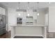 Modern kitchen with granite countertops and white cabinets at 9314 Dufaux Dr, Charlotte, NC 28278