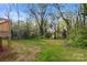 Wooded backyard with grassy area at 939 Stonewall S Ave, Rock Hill, SC 29730