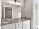 Bathroom with double vanity, granite countertop and large mirror at 939 Stonewall S Ave, Rock Hill, SC 29730