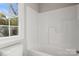 Clean bathroom with a bathtub, shower, and window at 939 Stonewall S Ave, Rock Hill, SC 29730