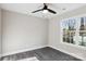 Bright bedroom with grey flooring and large window at 939 Stonewall S Ave, Rock Hill, SC 29730