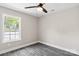 Bright bedroom with large window and ceiling fan at 939 Stonewall S Ave, Rock Hill, SC 29730