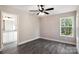 Spacious bedroom with ceiling fan and grey vinyl plank flooring at 939 Stonewall S Ave, Rock Hill, SC 29730