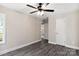 Bedroom with ceiling fan, grey vinyl plank flooring, and a closet at 939 Stonewall S Ave, Rock Hill, SC 29730