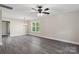 Dining room with gray flooring, chandelier, and large window at 939 Stonewall S Ave, Rock Hill, SC 29730