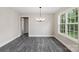 Bright dining room with gray flooring and a modern chandelier at 939 Stonewall S Ave, Rock Hill, SC 29730