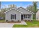 Newly constructed gray house with black shutters and a small front yard at 939 Stonewall S Ave, Rock Hill, SC 29730