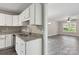 Modern kitchen with white cabinets and granite countertops at 939 Stonewall S Ave, Rock Hill, SC 29730