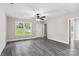 Spacious living room with gray vinyl plank flooring and ceiling fan at 939 Stonewall S Ave, Rock Hill, SC 29730