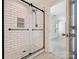 Modern bathroom with subway tile shower and updated fixtures at 9415 Kendall Dr, Charlotte, NC 28214