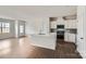 Modern kitchen with white cabinets, island, and stainless appliances at 9819 Old Garden Cir, Gastonia, NC 28056