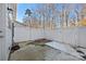 Small fenced backyard with concrete patio area at 1014 Beatty Woods Dr, Belmont, NC 28012