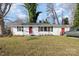 Ranch style home with red door, white siding, and a spacious lawn at 1046 Spratt St, Fort Mill, SC 29715