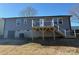 Elevated deck with stairs leading to the backyard at 110 Gilliatt St, Shelby, NC 28150