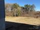 Private backyard with a mostly flat grassy area at 110 Gilliatt St, Shelby, NC 28150