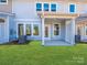 Covered back porch and exterior view offers an outdoor living space and rear entrance at 113 Quartz Hill Way, Waxhaw, NC 28173