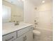 Bathroom featuring a sink with white cabinetry and a shower-tub combination at 113 Quartz Hill Way, Waxhaw, NC 28173