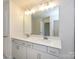 Bright Primary bathroom featuring a double sink vanity with quartz countertop and a large mirror at 113 Quartz Hill Way, Waxhaw, NC 28173