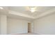Bedroom featuring carpet, trey ceiling with fan and recessed lighting, and an attached bathroom at 113 Quartz Hill Way, Waxhaw, NC 28173