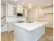 Open concept kitchen featuring a large center island, pendant lighting, and modern appliances at 113 Quartz Hill Way, Waxhaw, NC 28173