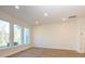 Spacious living room with recessed lighting, lots of natural light from the many windows, and hardwood flooring at 113 Quartz Hill Way, Waxhaw, NC 28173