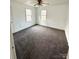 Comfortable bedroom with neutral walls, carpet, and ceiling fan. Windows provide natural light at 1196 Old Thompson Ave, Lancaster, SC 29720