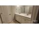 Double vanity bathroom with white cabinets and brushed gold fixtures at 135 Ella Claire Dr, York, SC 29745