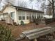 Single story home with large windows and a deck at 135/137 Indian Harbor Trl # E16/17, Mount Gilead, NC 27306