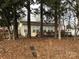 House exterior showcasing a wooden deck and surrounding foliage at 135/137 Indian Harbor Trl # E16/17, Mount Gilead, NC 27306