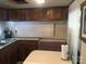 Cozy kitchen with ample cabinetry and a dining area at 135/137 Indian Harbor Trl # E16/17, Mount Gilead, NC 27306