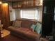 Comfortable living area with sofa and access to bathroom at 135/137 Indian Harbor Trl # E16/17, Mount Gilead, NC 27306