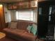 Relaxing living area with sofa and access to bathroom at 135/137 Indian Harbor Trl # E16/17, Mount Gilead, NC 27306