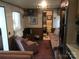 Cozy living room with seating and a view into the bathroom at 135/137 Indian Harbor Trl # E16/17, Mount Gilead, NC 27306