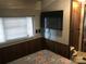 Main bedroom with TV and window coverings at 135/137 Indian Harbor Trl # E16/17, Mount Gilead, NC 27306