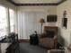 Relaxing sitting area with comfortable recliner and large window at 135/137 Indian Harbor Trl # E16/17, Mount Gilead, NC 27306