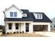 Charming two-story home featuring a black roof, black door, and attached garage at 13605 Tranquil Day Dr, Matthews, NC 28105