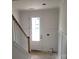 Hallway with a staircase and a door at 13605 Tranquil Day Dr, Matthews, NC 28105
