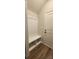 Built-in bench with storage in hallway, white with vertical shiplap at 139 Ella Claire Dr, York, SC 29745