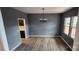 Formal dining room with gray walls, hardwood floors, and a chandelier at 139 Ella Claire Dr, York, SC 29745