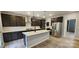 Modern kitchen with dark cabinets, quartz countertops, and stainless steel appliances at 139 Ella Claire Dr, York, SC 29745
