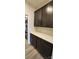 Walk-in pantry with dark brown cabinets and white quartz countertops at 139 Ella Claire Dr, York, SC 29745