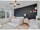 Bedroom with a daybed, dark accent wall, and window at 14015 Helen Benson Blvd, Davidson, NC 28036