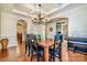 Elegant dining room with chandelier and access to kitchen at 14015 Helen Benson Blvd, Davidson, NC 28036